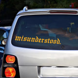 Car with 'misunderstood.' decal on the back window