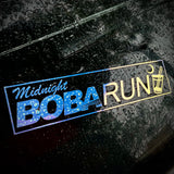 Reflective 'Midnight Boba Run' logo on a dark surface