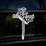 White cross with nail design on a car window