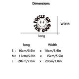 Dimensions chart for car stickers with a smiley face design and text 'Focus on the Good'.