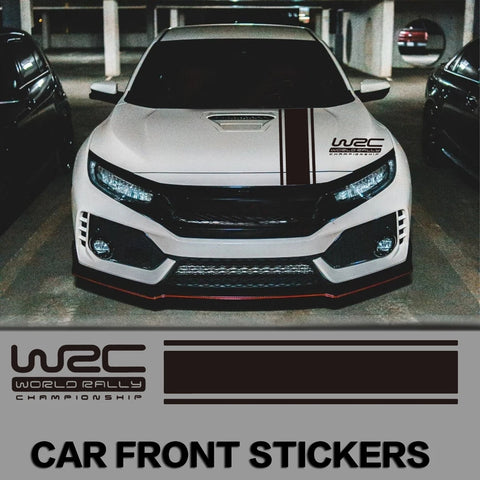 White car with WRC stickers in a parking garage