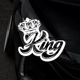 White 'King' decal with a crown on a black car.