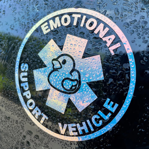 Emotional Support Vehicle sticker with duck icon on a wet surface