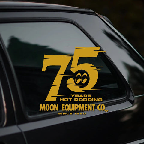 Yellow '75 Years Hot Rodding' sticker on a car window with branding text.