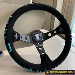 Black steering wheel with decorative elements on a neutral background