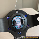Close-up of a metallic object with a circular design and blue accents, featuring 'Pablo Edition' text.