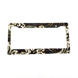 A pair of Tsunami Waves license plate frames featuring iconic ukiyo-e wave artwork in deep blue and gold tones.