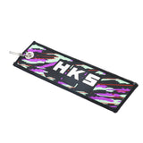 Purple and turquoise HKS flight tag with white logo for tuner enthusiasts.